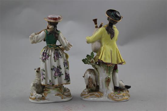 A pair of Meissen groups of a musical shepherd and shepherdess, 20th century, 16cm. and 15cm., minor losses to leaves